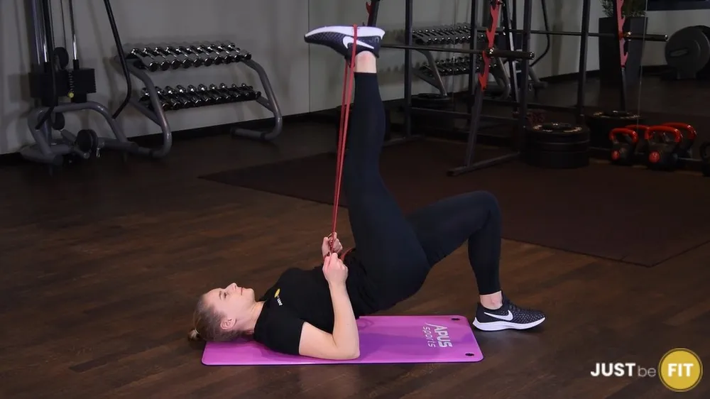 ejercicios de glúteos, elevaciones de cadera con una sola pierna con power band